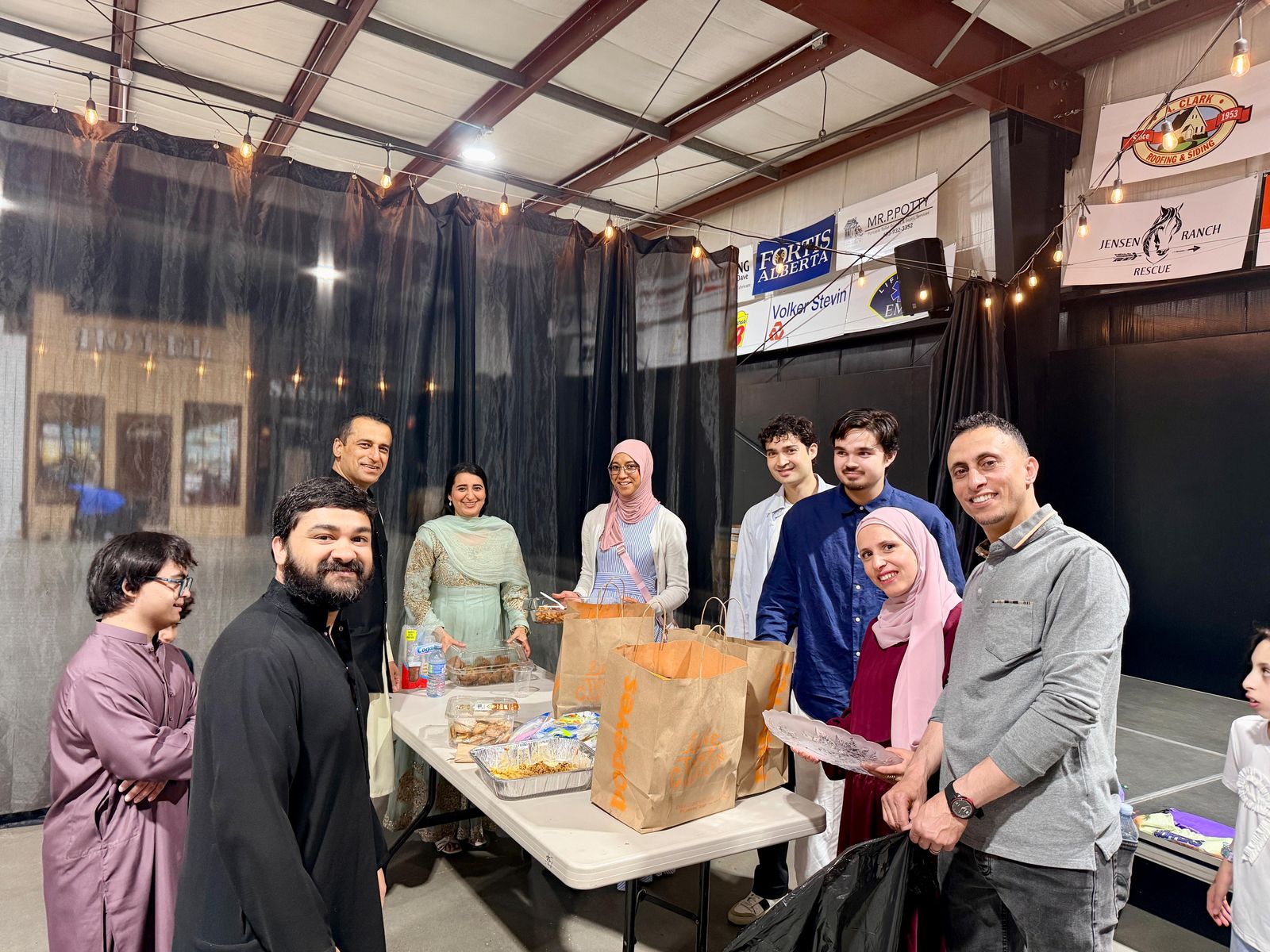 Volunteers serving refreshments at a Muslims of Cochrane event